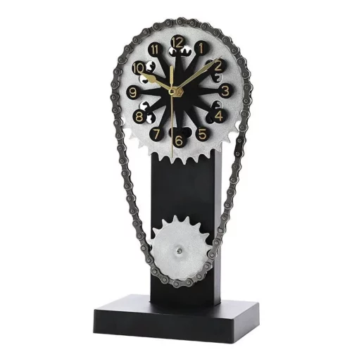 Horloge de bureau noire avec cadran rond, chaîne apparente et engrenages argentés