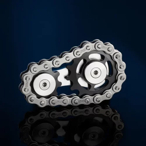 Spinner mécanique avec deux pignons noirs de tailles différentes, boutons argentés et chaîne métallique apparente