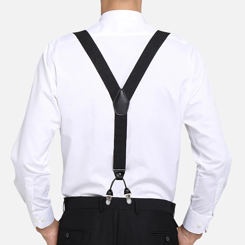 Vue arrière des bretelles noires en Y, avec raccord central cousu et deux pinces fixées au pantalon